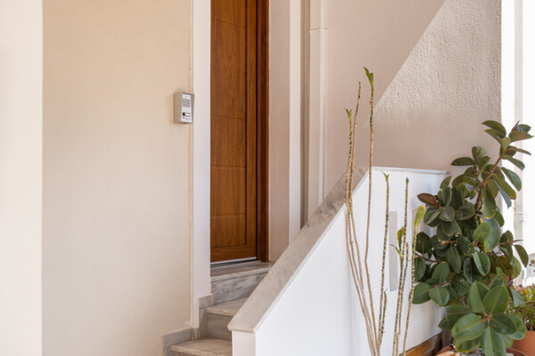 Entrance staircase with plants leading to Azzure Studio in Kokkari Samos