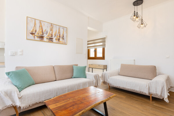 Living room with sofas and coffee table in modern interior at Azzure Studio in Kokkari Samos