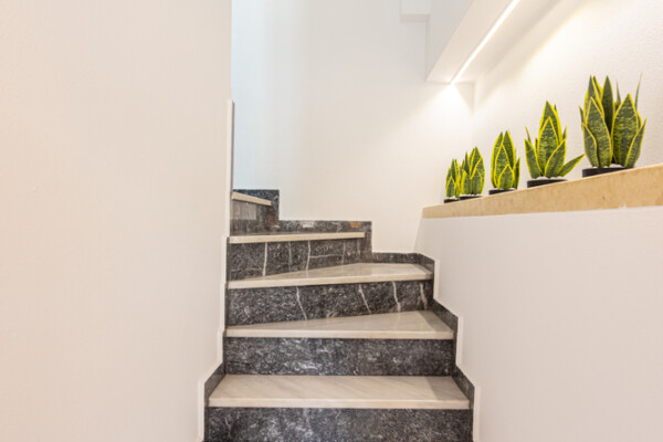 Modern marble staircase with decorative plants at Azzure Studio in Kokkari Samos