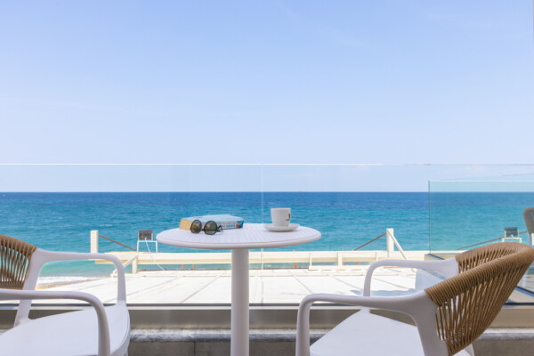 Sea view balcony with table coffee and chairs overlooking the Aegean Sea at Azzure Studio in Kokkari Samos